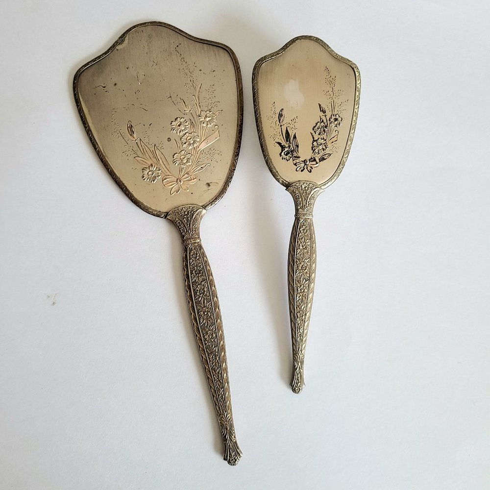 Vintage hand mirror with and hair brash. Vanity set. Made in USA.